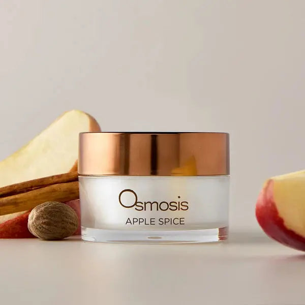 Osmosis Apple Spice Warming Enzyme Mask in a jar with a label, showcasing the skincare product for facial treatment.