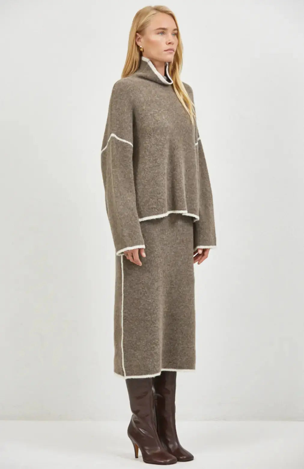 A.ren Brianne Sweater in a cozy knit, styled with a midi skirt, displayed on a model showcasing its fit and texture.