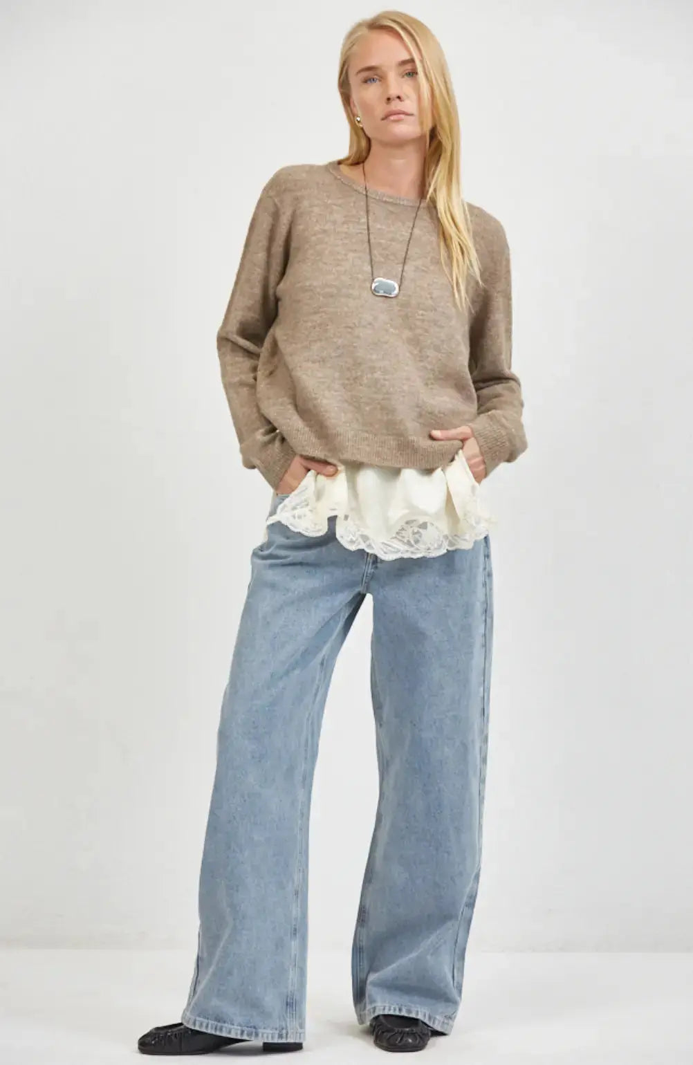 A.ren The Haven beige knit sweater, lightweight and cozy, shown on a model with a relaxed fit, perfect for casual wear.