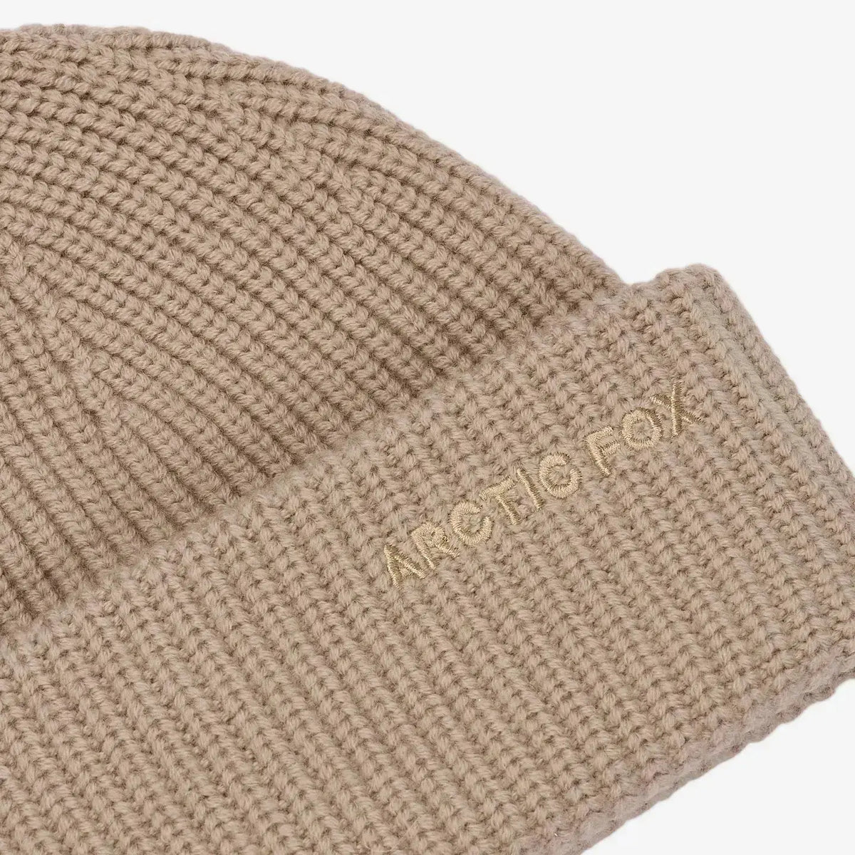 Arctic Fox Cashmere Beanie in soft, warm fabric, displayed on a neutral background, showcasing its cozy, stylish design.