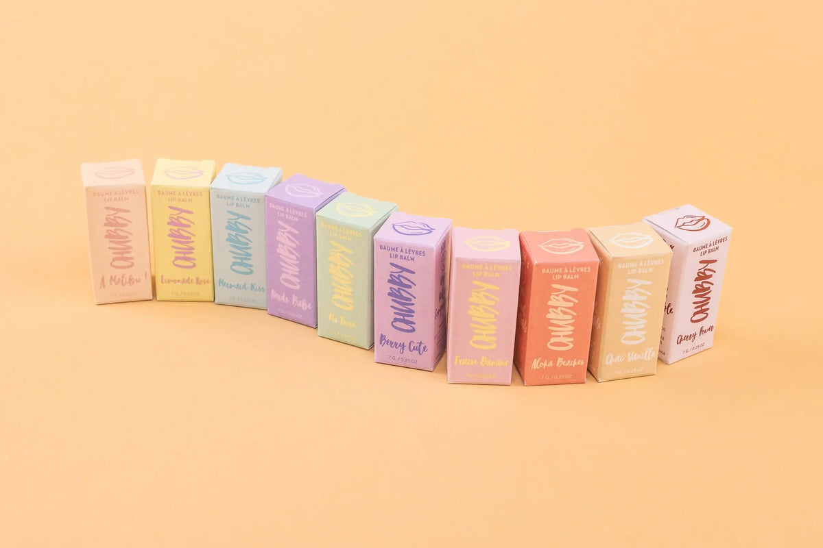 Caprice & Co Chubby Vegan Lip Balm featuring tropical flavors like Aloha Beaches, Pina Colada, and Mango in colorful packaging.