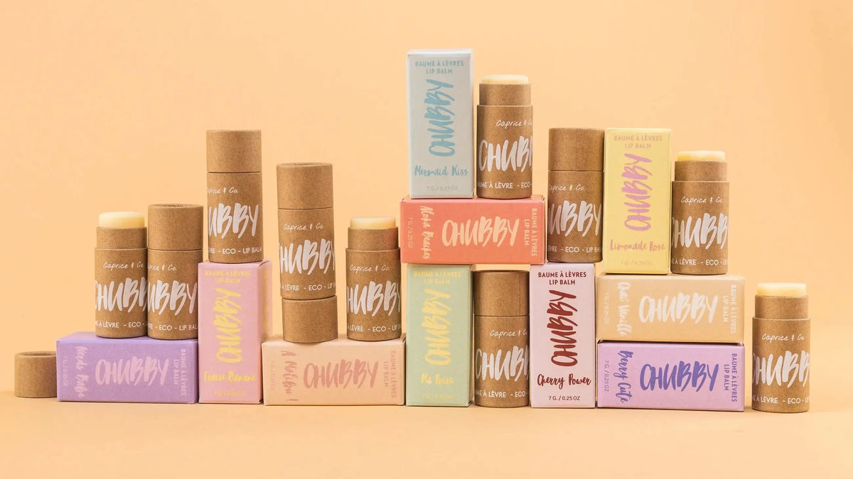 Caprice & Co Chubby Vegan Lip Balm with tropical flavors like Aloha Beaches, Pina Colada, and Mango, in colorful packaging.