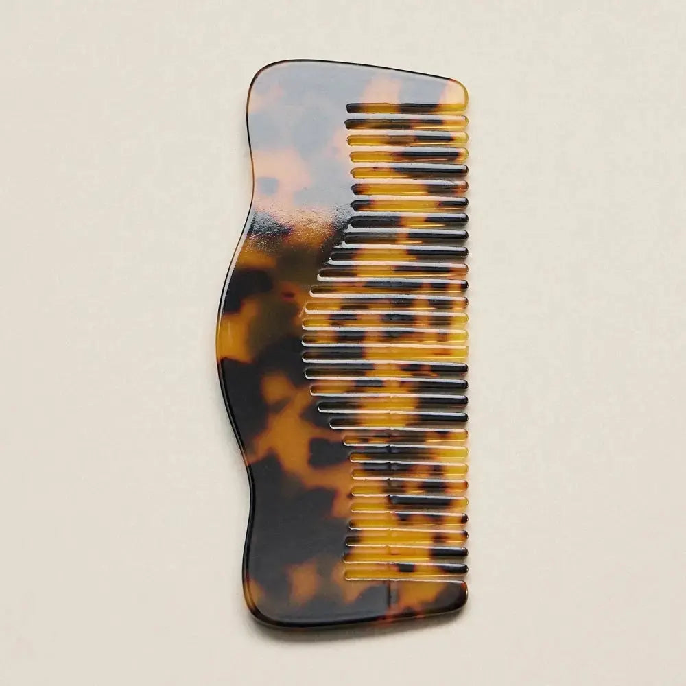 Frem Pink Confetti Marble Wave Comb, a stylish hair accessory with a pink and marble pattern, designed for easy hair styling.