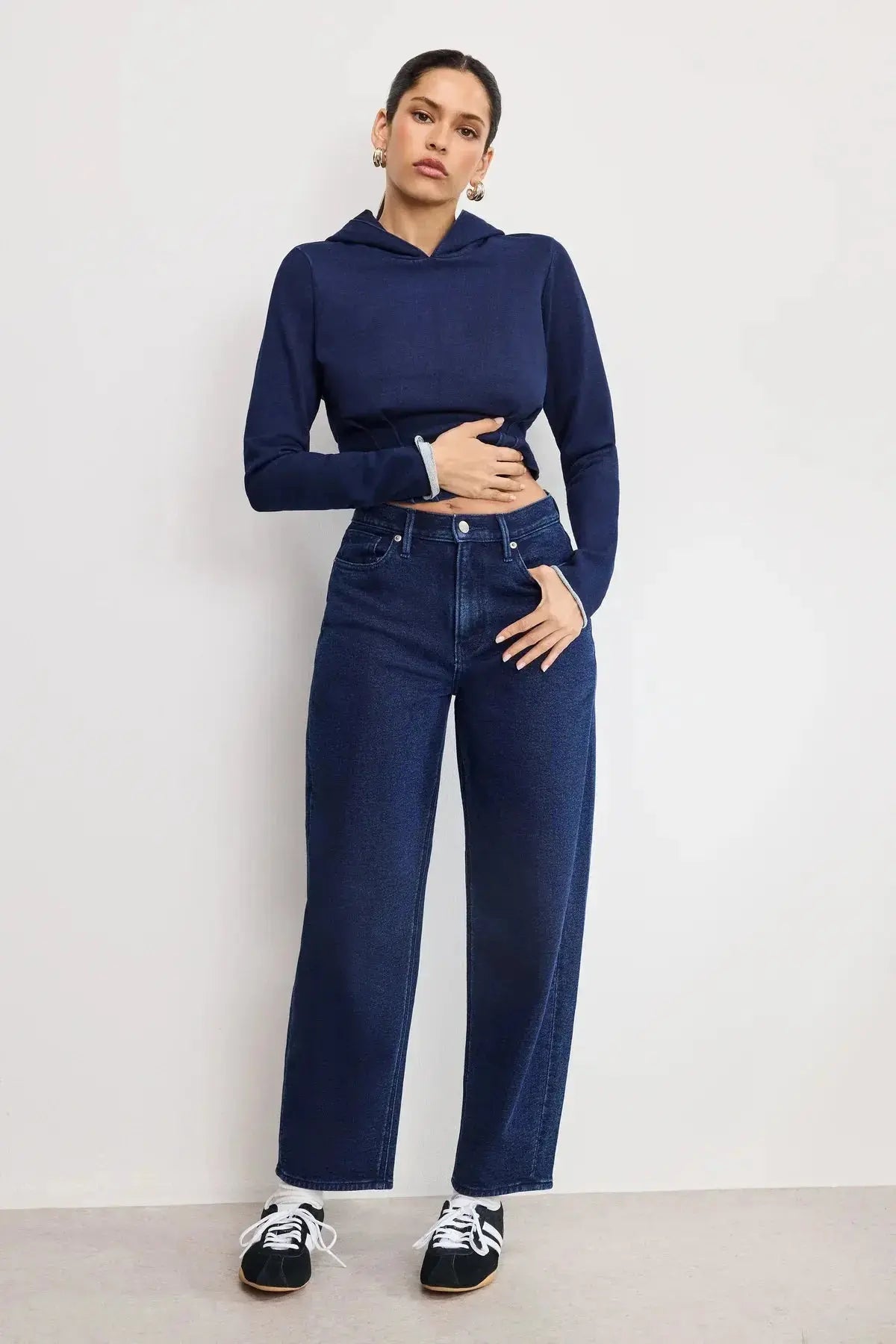 Good American Jeanius Barrel Pants in denim, showcasing high-waisted, relaxed fit with stylish stitching and classic pocket details.