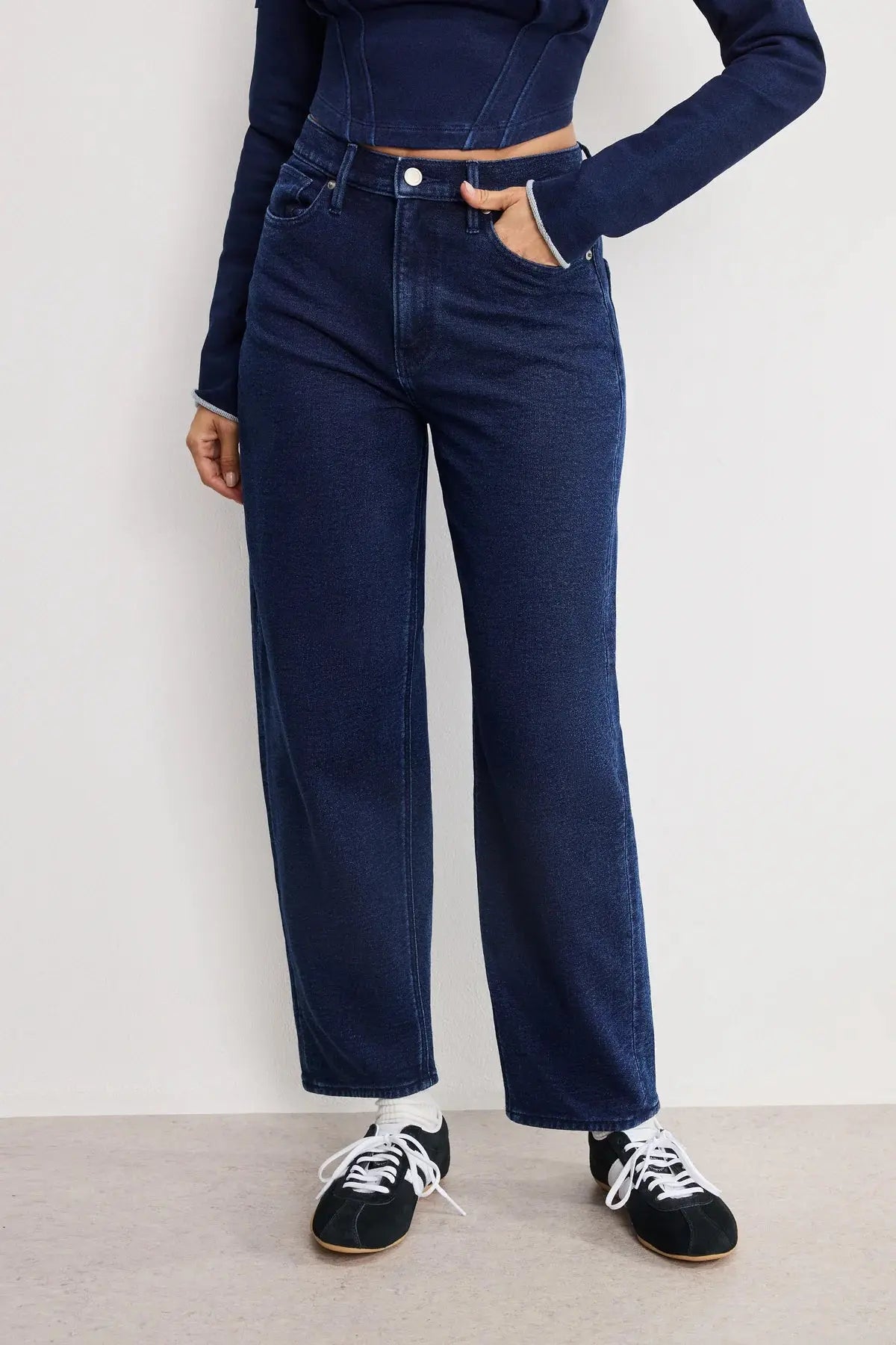 Good American Jeanius Barrel Pants in denim, featuring a high-waist design and relaxed fit, displayed on a model.