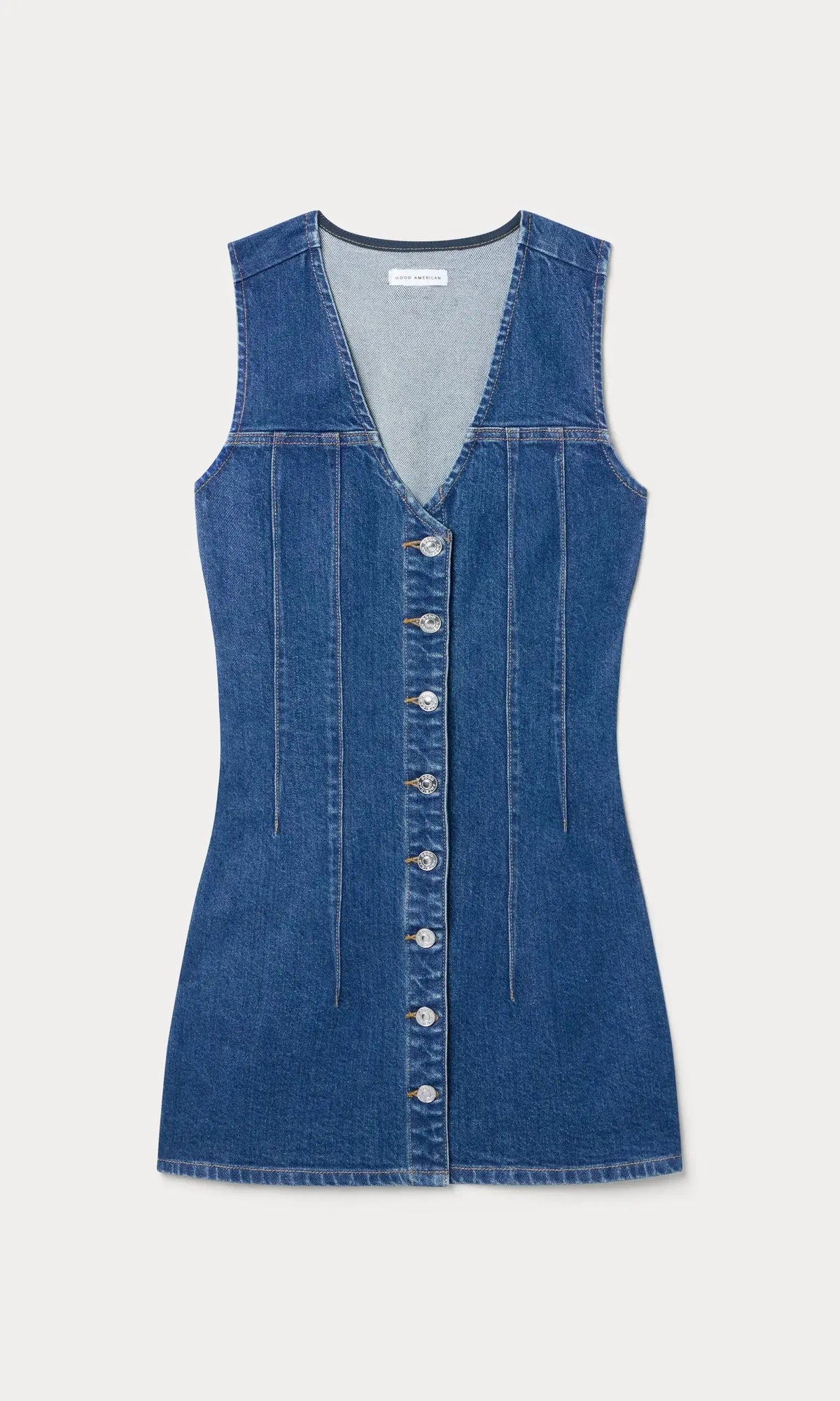 Good American Harper denim dress shown on a model, featuring a classic blue denim look and casual fit.