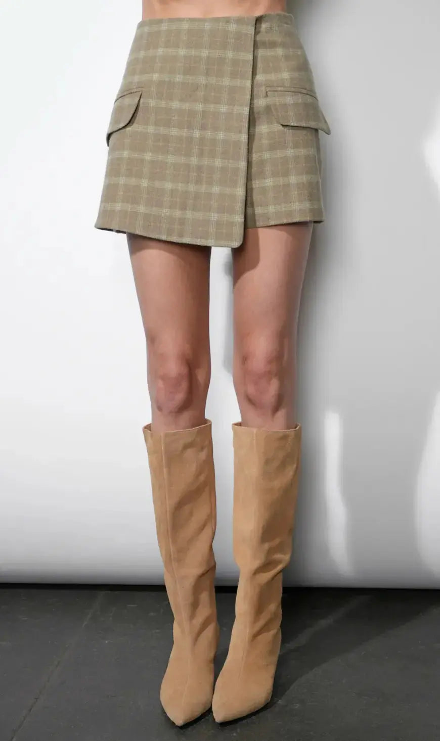 Gray and white plaid Greylin Aria wrap skort featuring a stylish wrap design and comfortable fit.