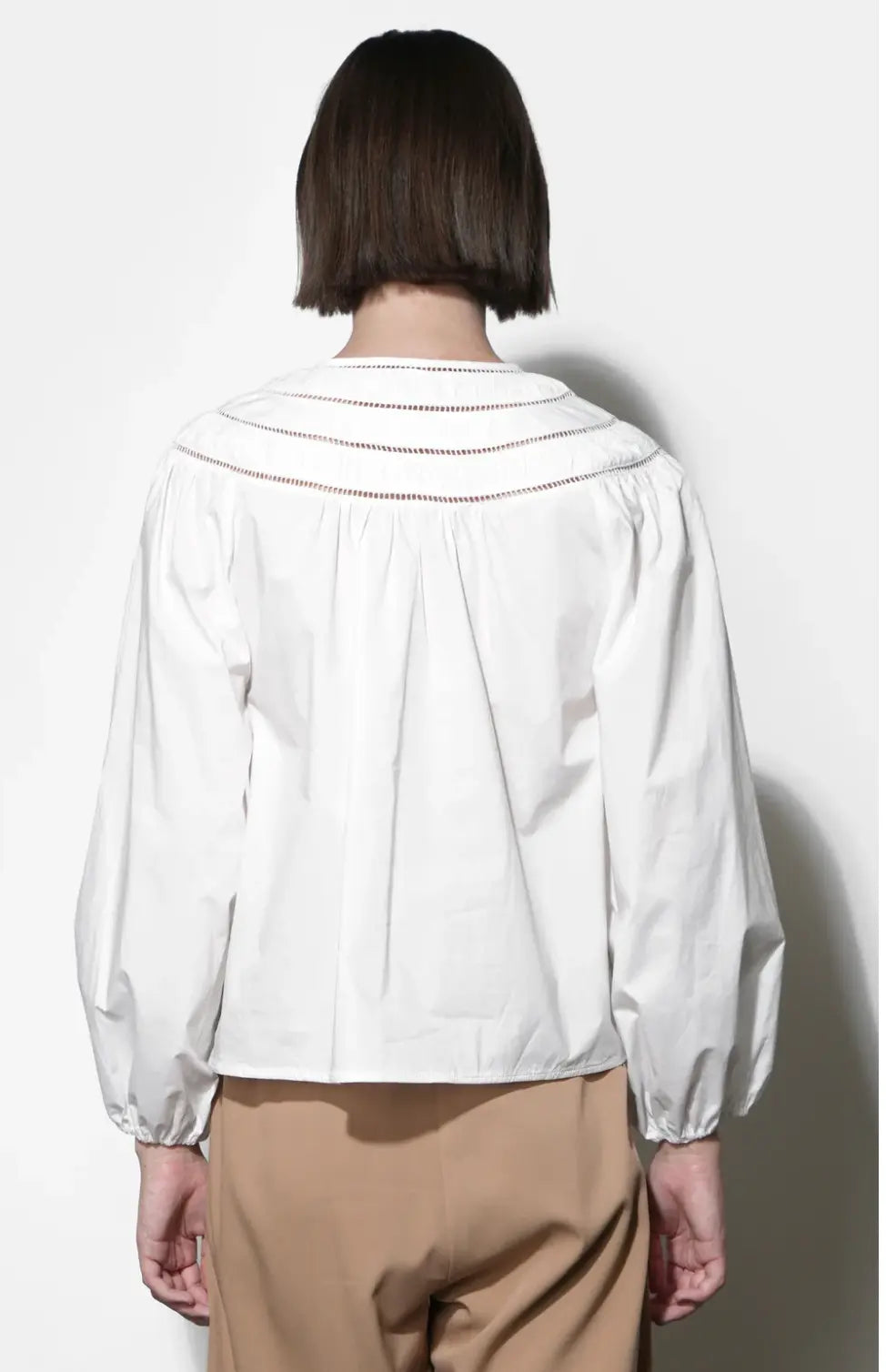 White cotton Hadlee blouse by Greylin, showcasing a stylish women's apparel top with a classic collar and button-down front.