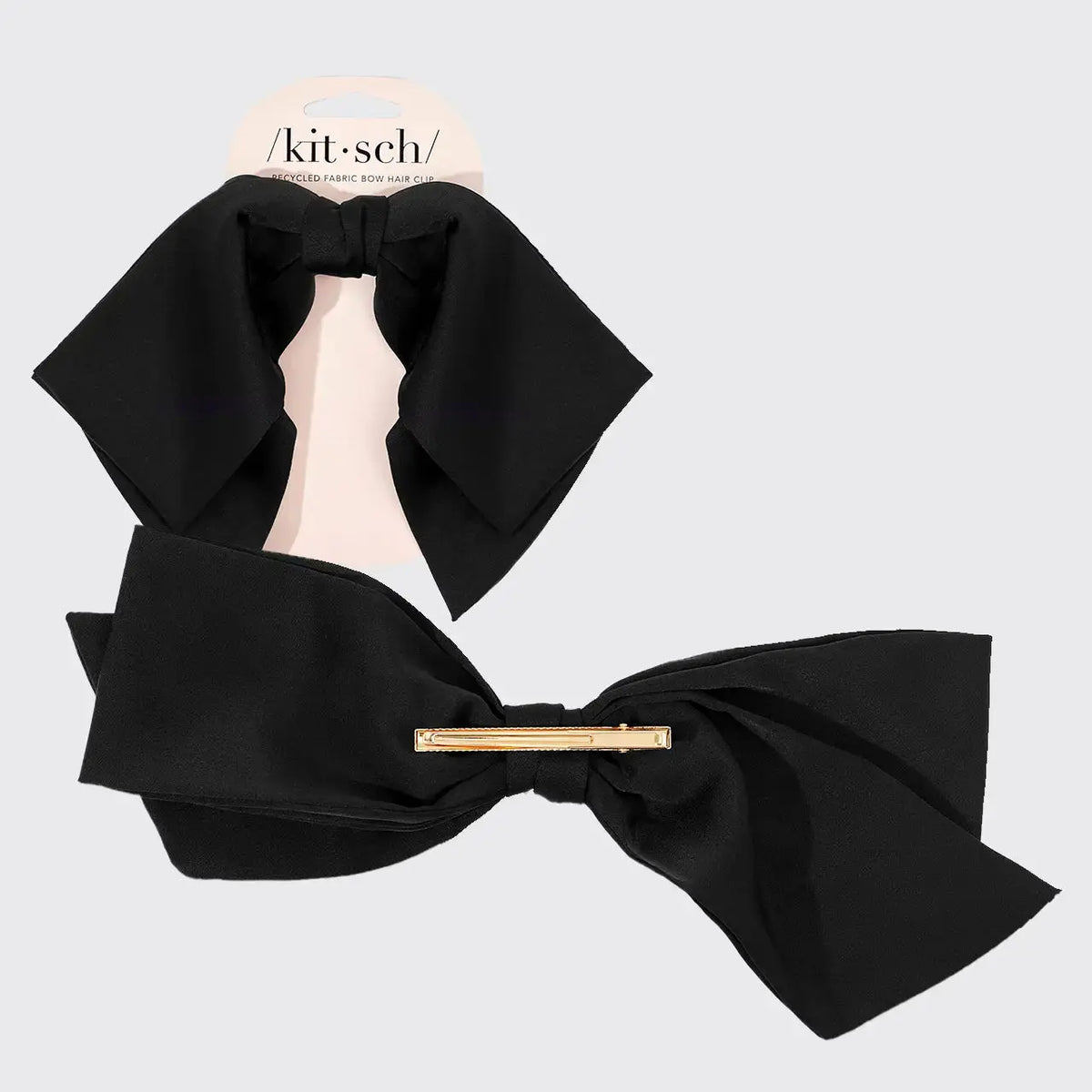Fabric bow hair clip from hair brand, featuring a soft, stylish accessory for hair styling and decoration.
