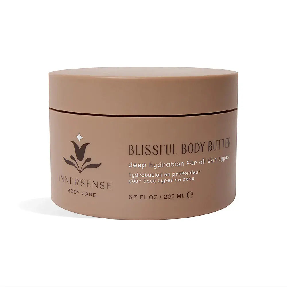 Innersense Organic Beauty Blissful Body Butter jar with a smooth, creamy texture visible on a white background.