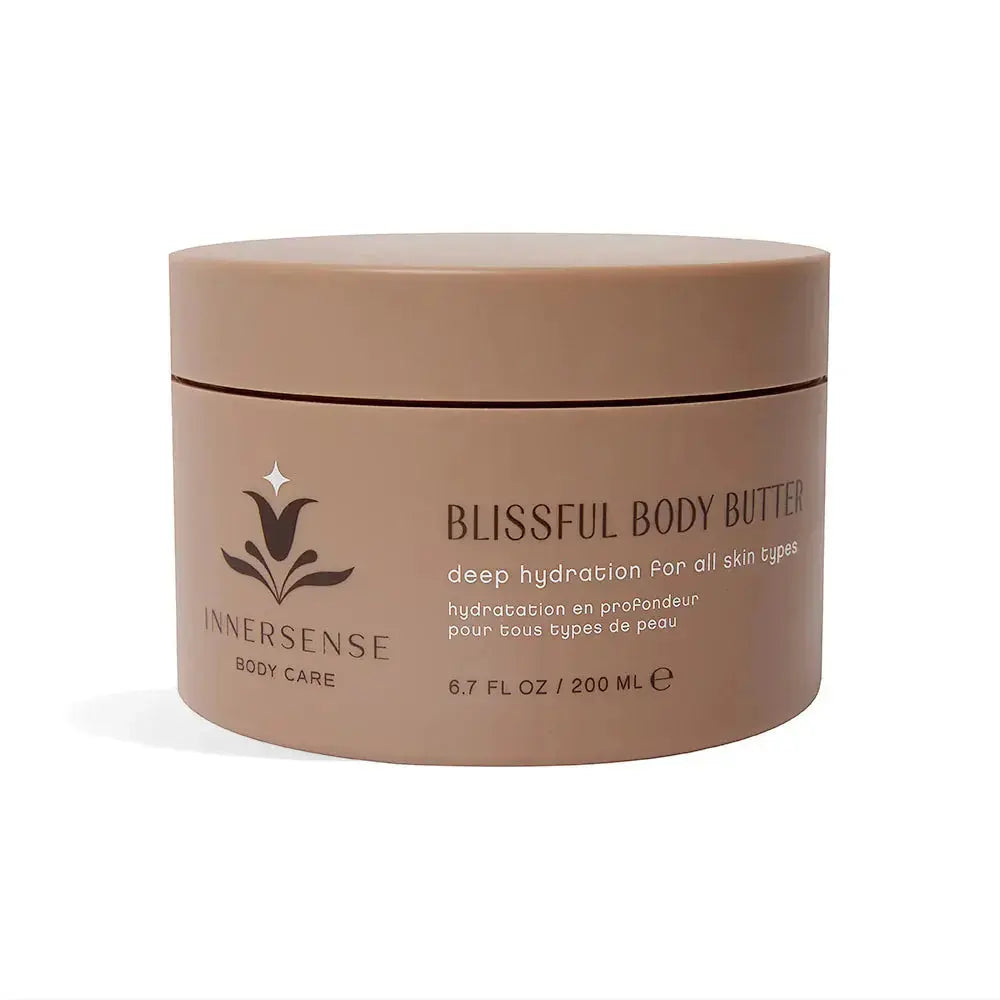 Innersense Organic Beauty Blissful Body Butter jar with a smooth, creamy texture visible on a white background.