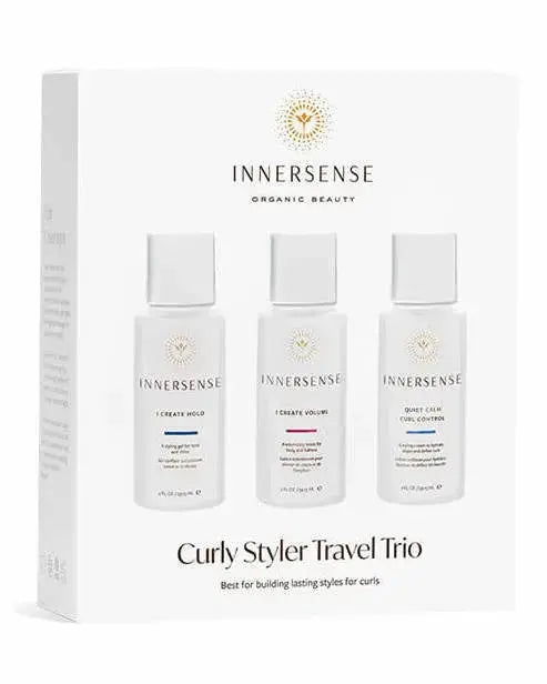 Innersense Organic Beauty Curly Styler Travel Trio with curl-enhancing products in travel-sized bottles on a white background.