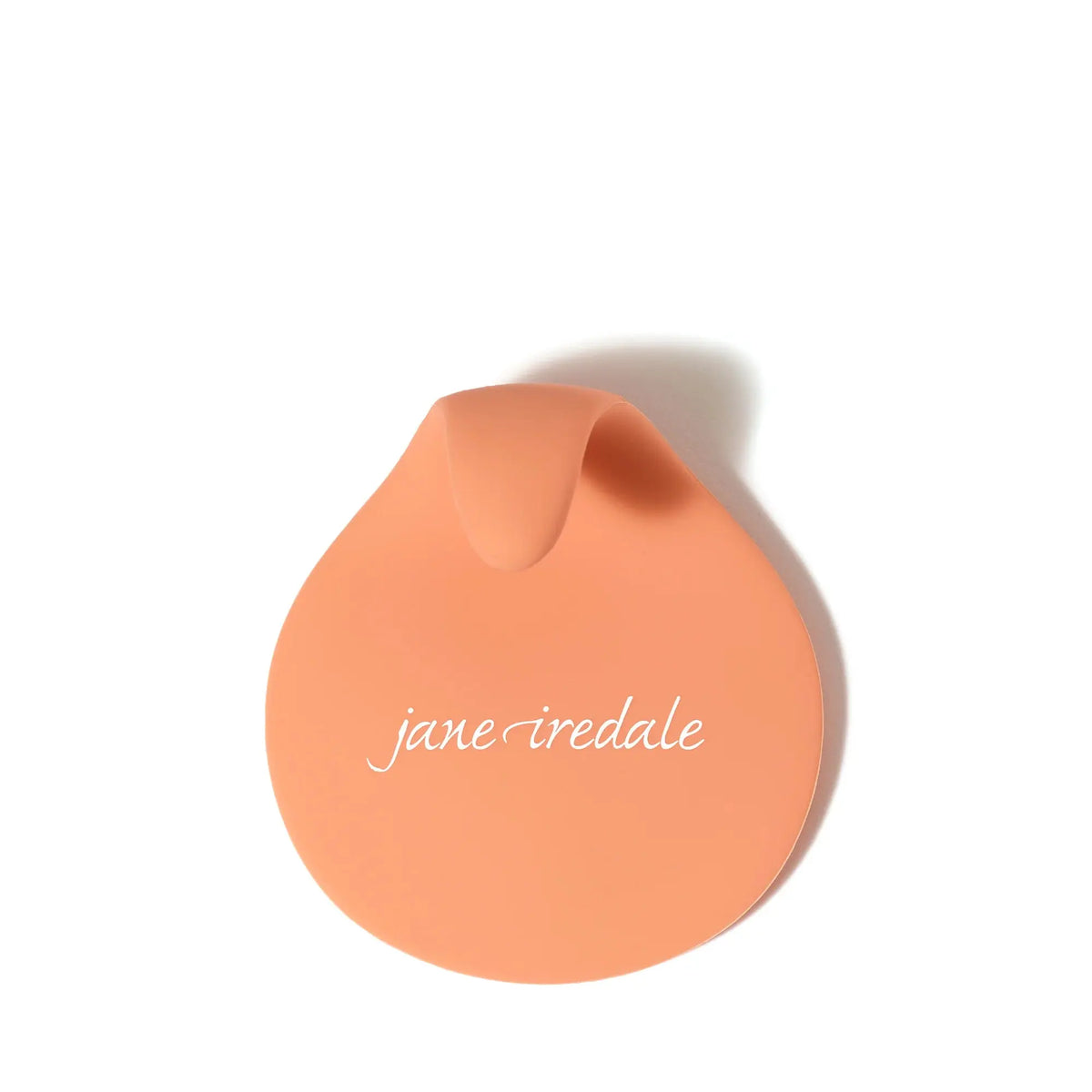 Jane Iredale brush cleaning pad with textured surface for easy makeup brush cleaning and maintenance.