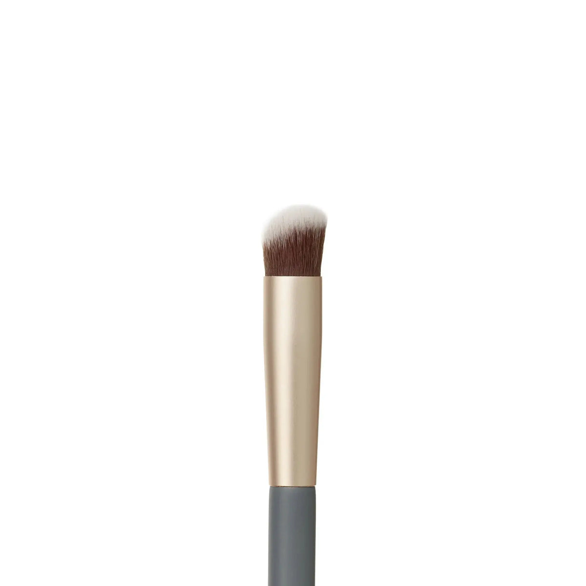 Jane Iredale concealer brush with soft bristles for precise makeup application and blending on skin.