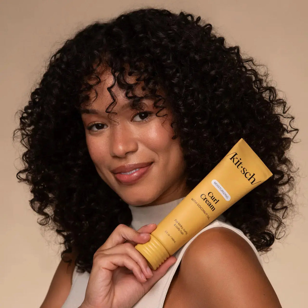 Kitsch moisturizing curl cream in a tube, designed to define and hydrate curly hair for a soft, frizz-free finish.