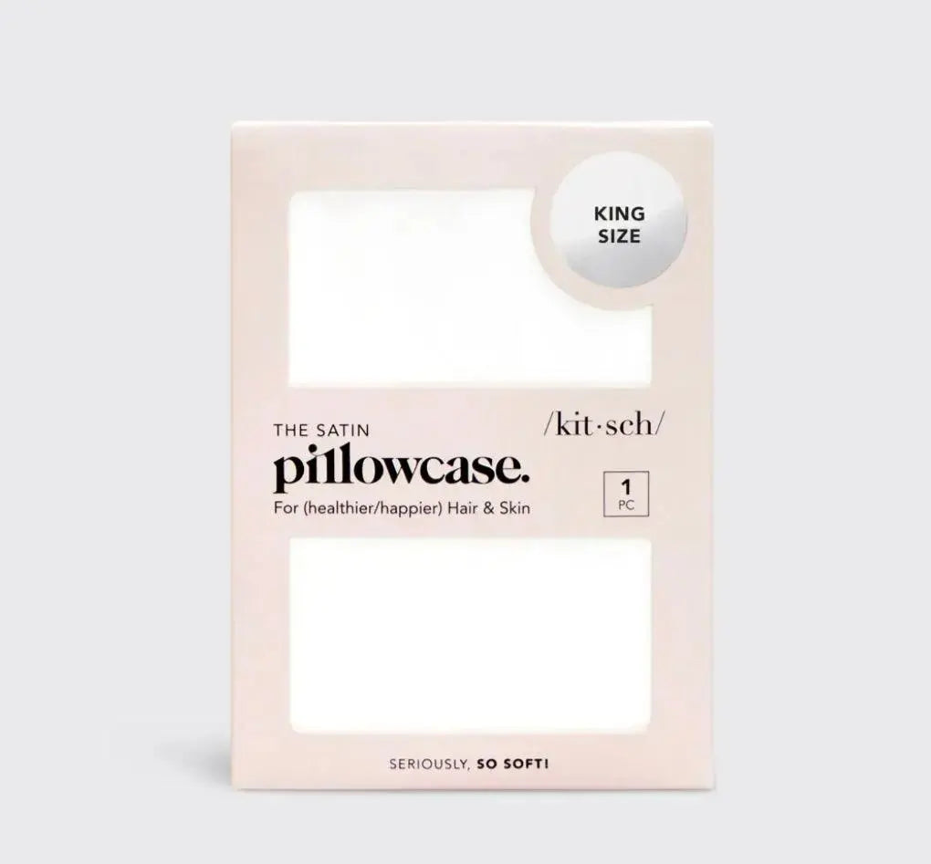 Ivory satin pillowcase by Kitsch designed for hair protection, showcasing smooth, shiny fabric with a subtle sheen and neat stitching.