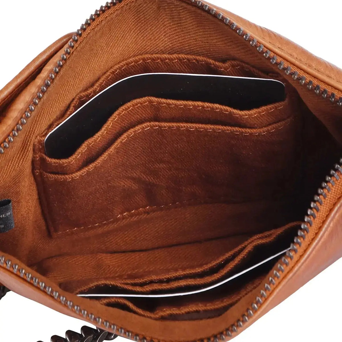 Latico Tati handcrafted leather crossbody bag in cognac color with adjustable strap and sleek design.