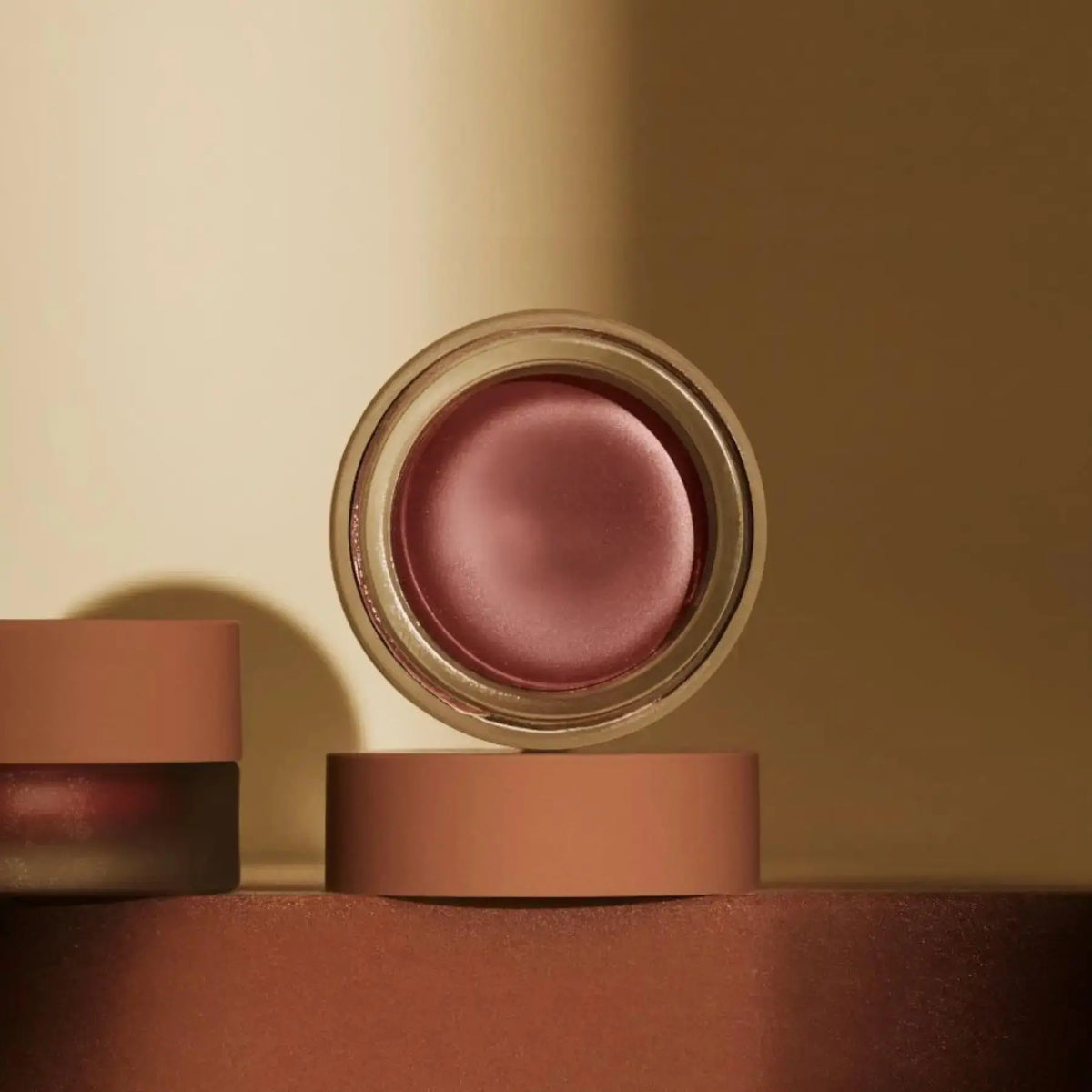 Minori Cream Blush in Orchid, a natural makeup product with a soft, creamy texture and floral pink color.