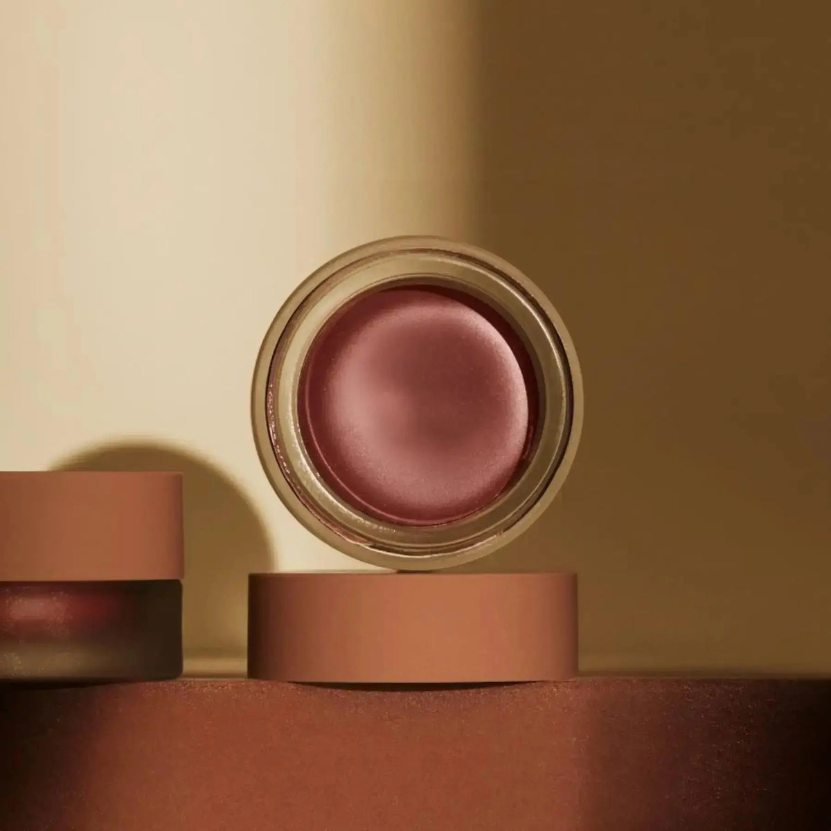 Minori Cream Blush in Orchid, a natural makeup product with a soft, creamy texture and floral pink color.