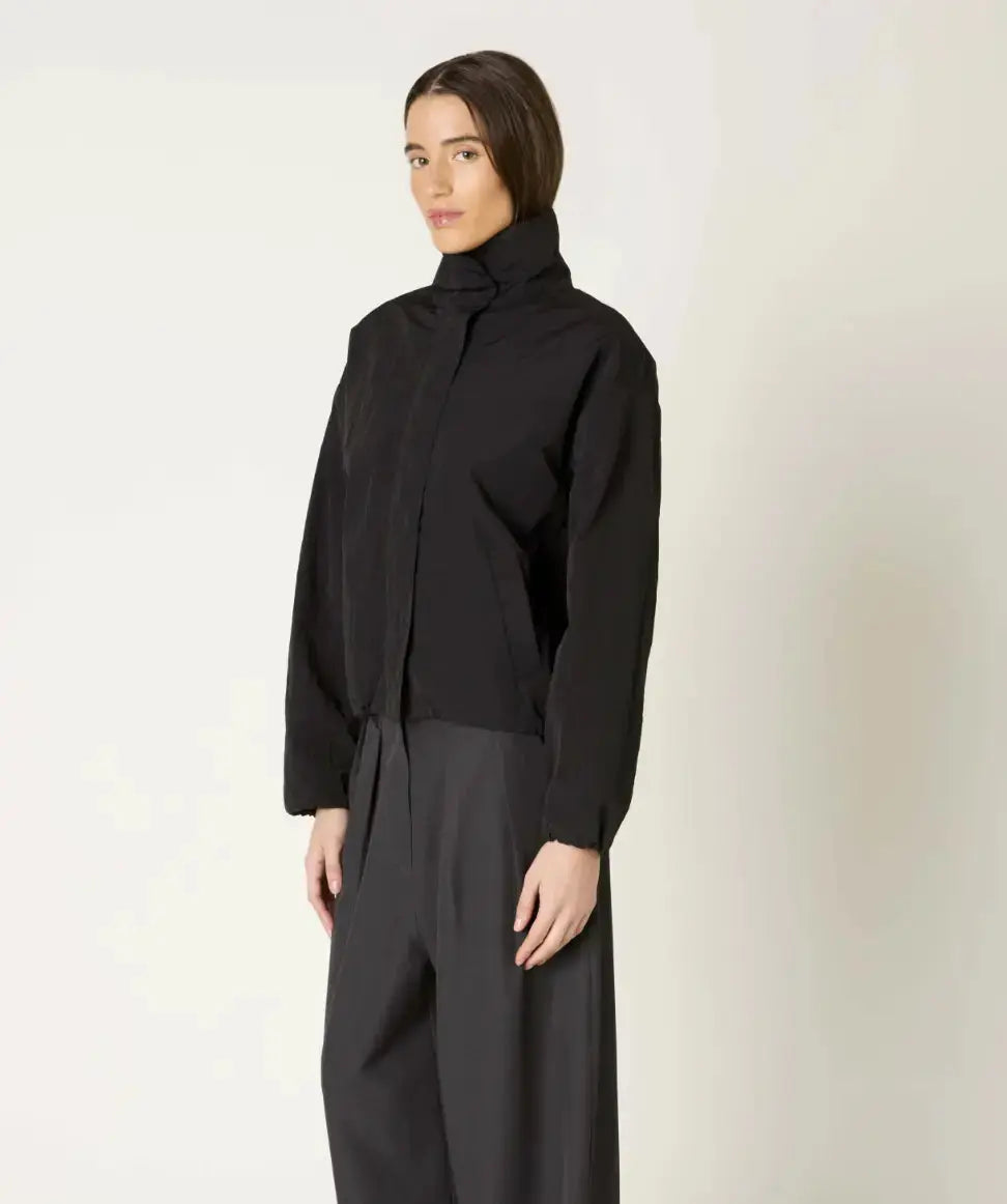 NIA Hindley bomber jacket in extra small size, stylish black apparel with a zip front and ribbed cuffs and hem.