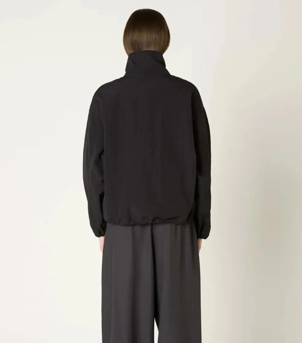 NIA Hindley bomber jacket in extra small size, stylish black apparel with a ribbed collar and zip-up front.