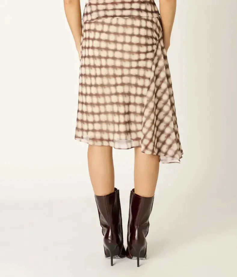 NIA Parce skirt in extra small size, stylish apparel with a fitted design, shown in a natural fabric color.