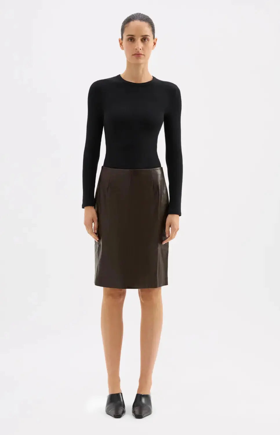 Nude Lucy Lenny vegan leather pencil skirt in extra small size, sleek black design, close-up view of fitted apparel.
