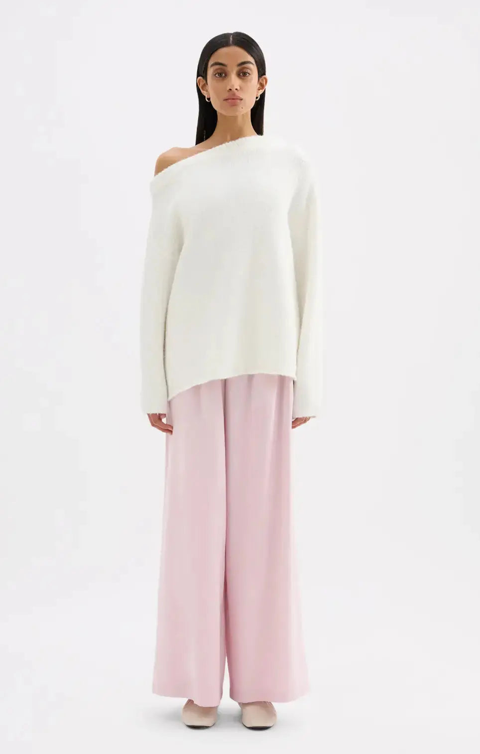 Nude Lucy Lavinia off-shoulder knit in soft fabric, featuring a relaxed fit and stylish neckline, perfect for casual wear.