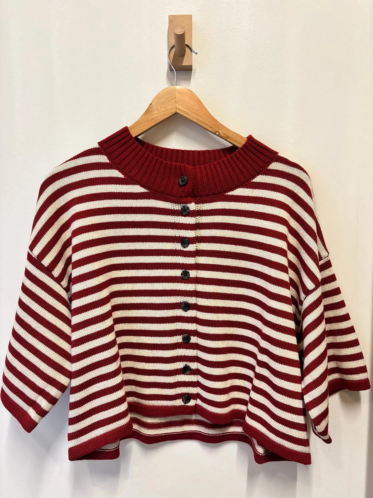 Olivaceous Briar striped cardigan, lightweight knit apparel with blue and white horizontal stripes, button-up front, and ribbed cuffs.