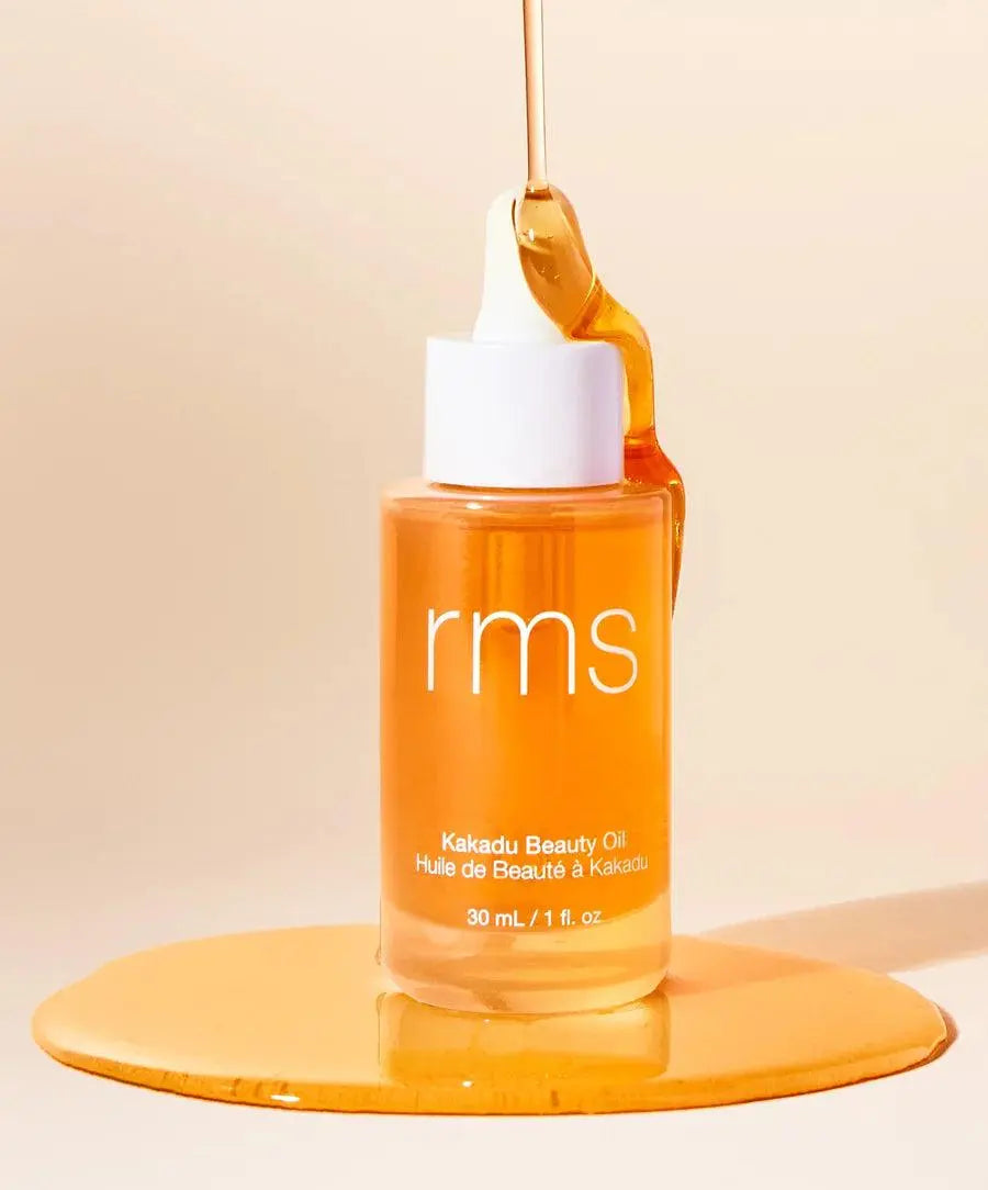 RMS Beauty Kakadu Beauty Oil in 30ml bottle, cosmetic skincare product with golden liquid, natural ingredients, and elegant packaging.