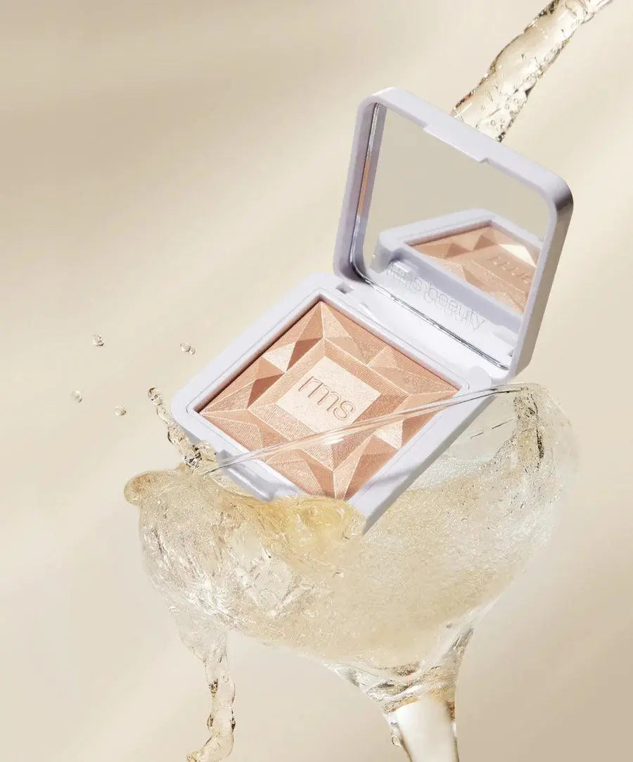RMS Beauty ReDimension Hydra Dew Luminizer in Prosecco Fizz, a luminous cosmetic highlighter with a dewy finish.