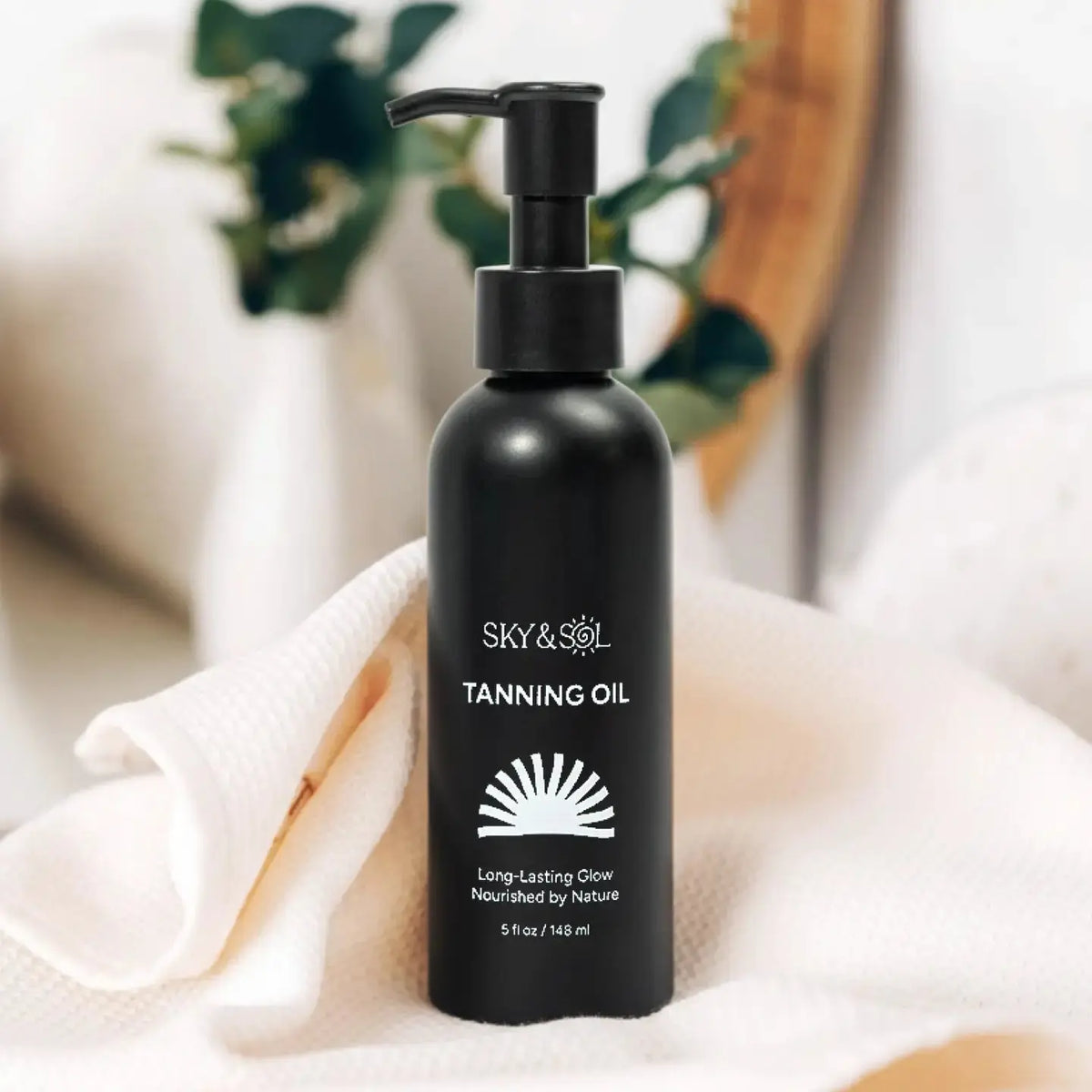 Bottle of Sky and Sol Natural Tanning Oil with pump dispenser, featuring a tropical-themed label and golden-colored oil inside.