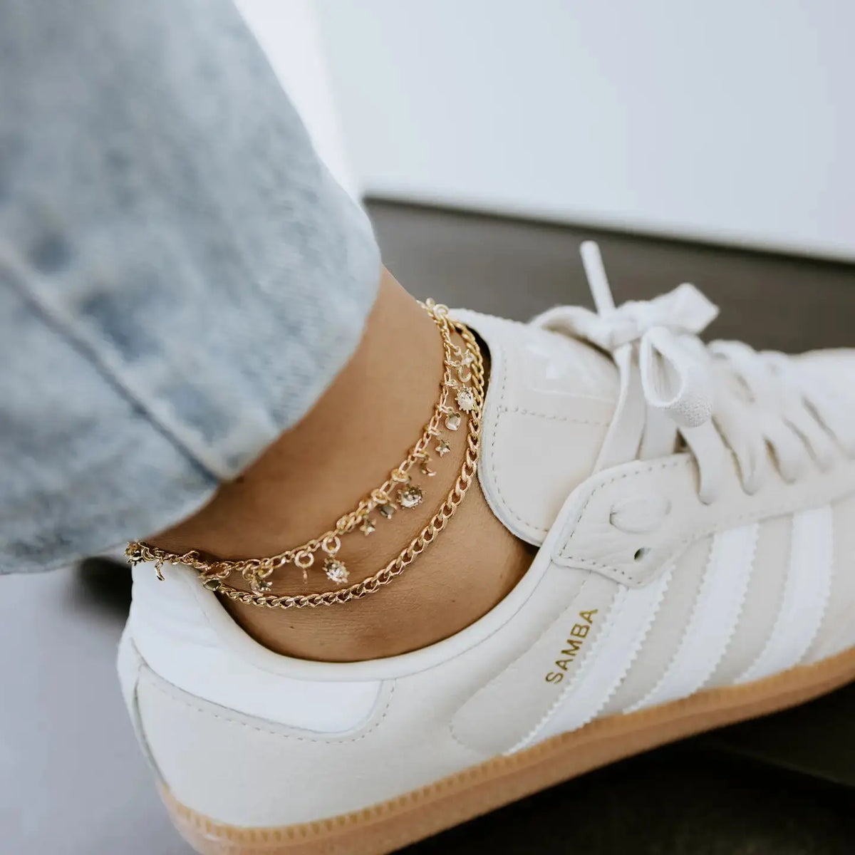 Gold charm anklet with delicate chain and small decorative charms, stylish jewelry piece from Sydney Rose Co.