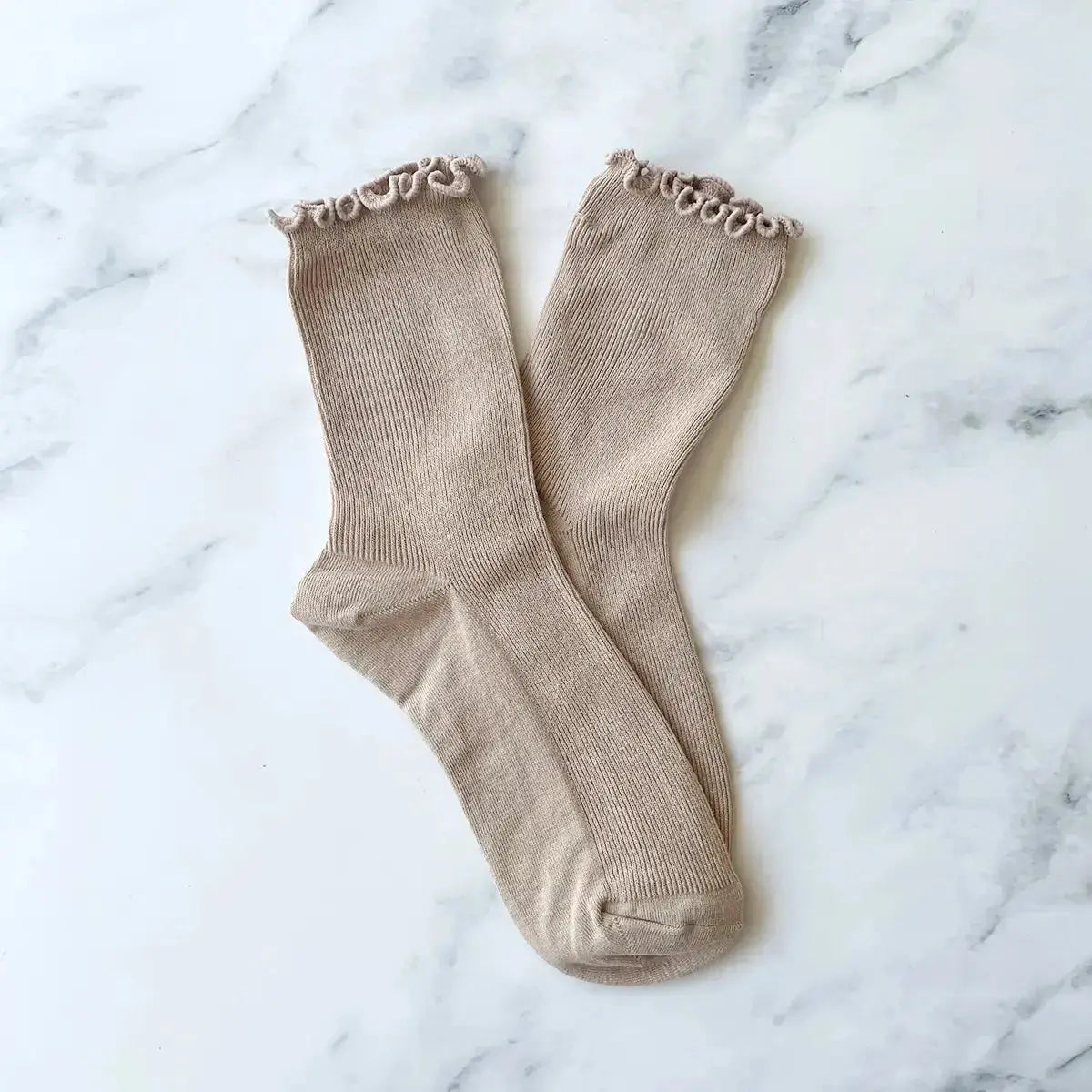 Black Wednesday Ruffle Socks by Tiepology, showing a close-up of stylish, ruffled ankle socks with a soft fabric texture.