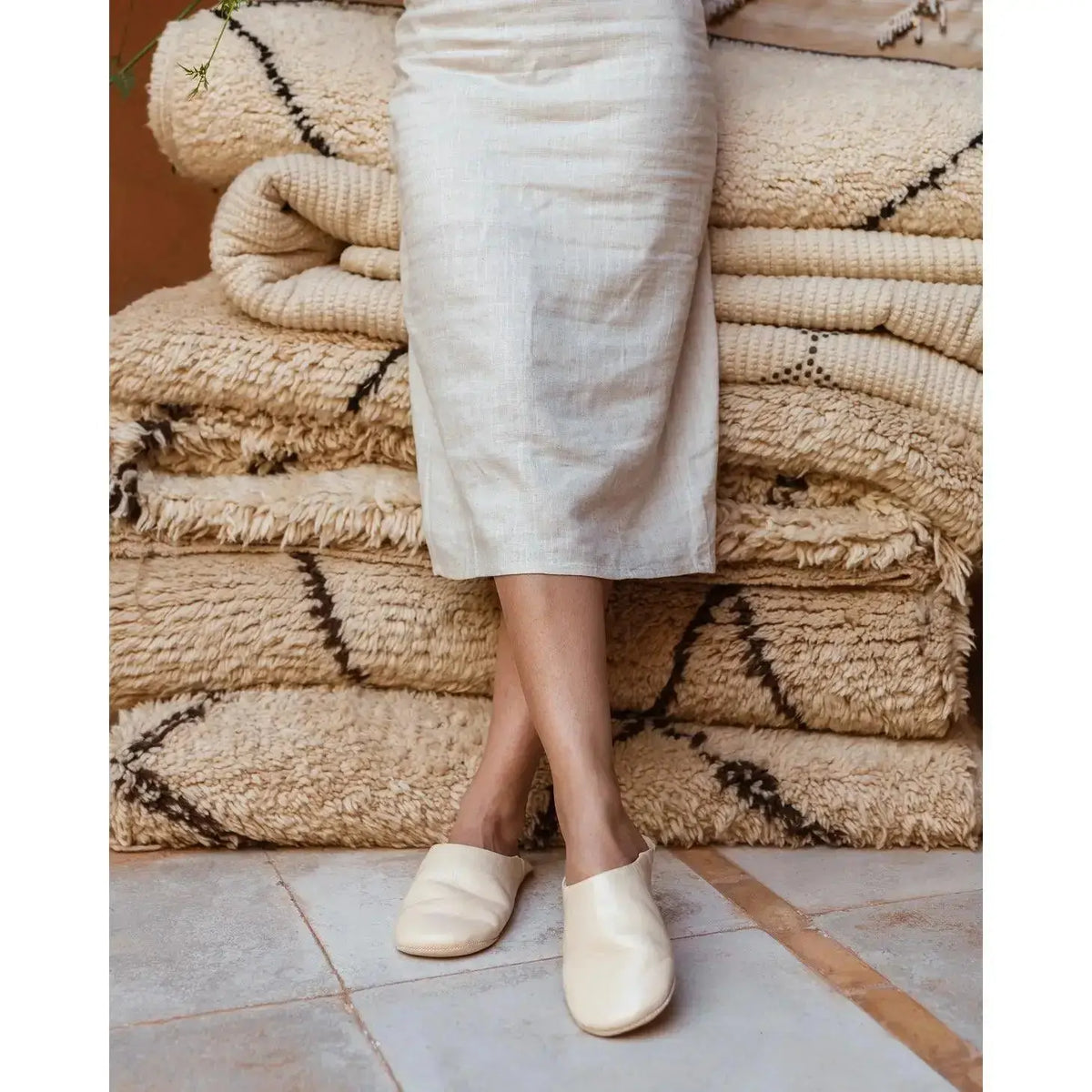 Chalk-colored Moroccan leather slippers by Bohemia Design with a solid, handcrafted design and soft leather texture.