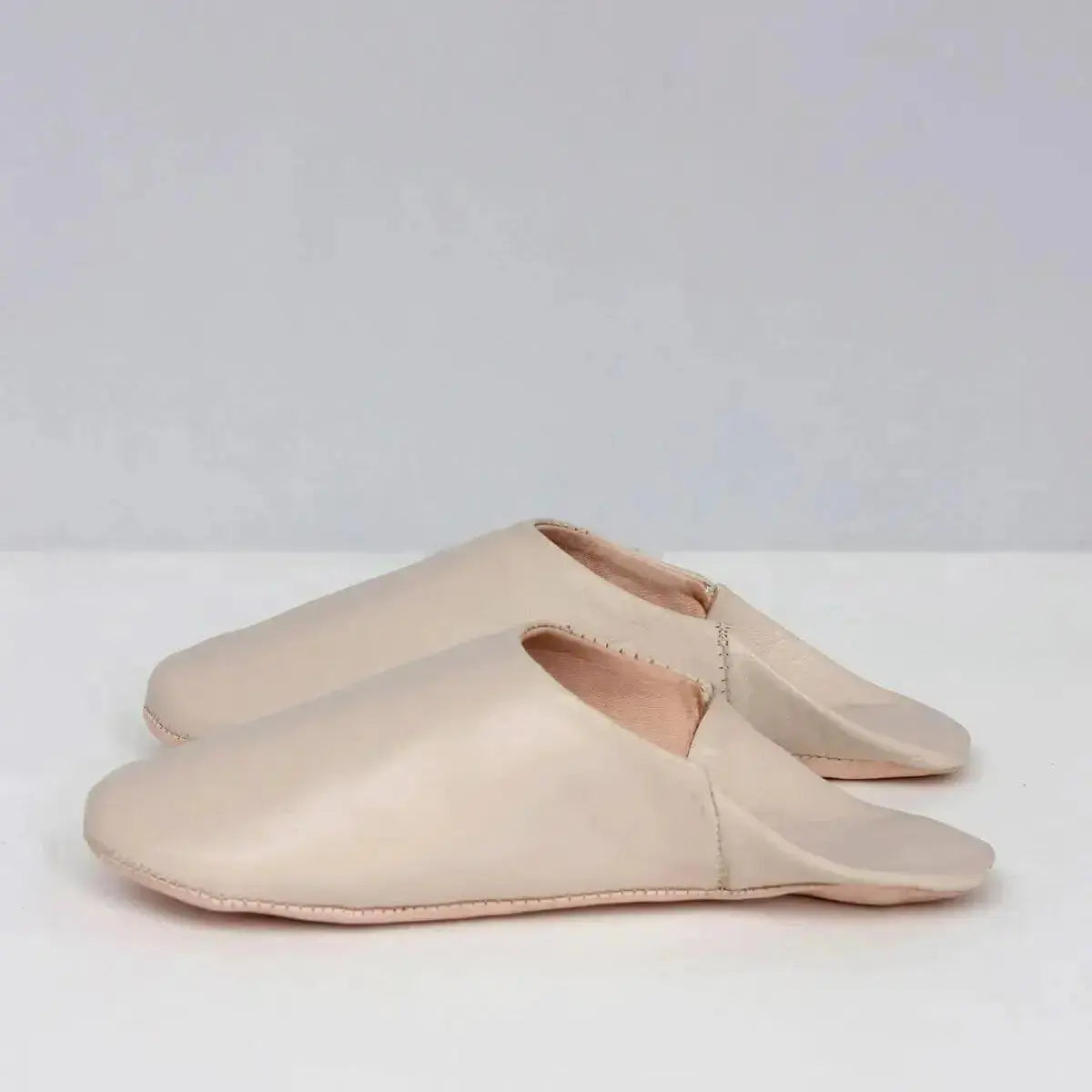 Solid Moroccan leather slippers by Bohemia Design featuring handcrafted chalk-colored slip-on slippers with a soft leather finish.