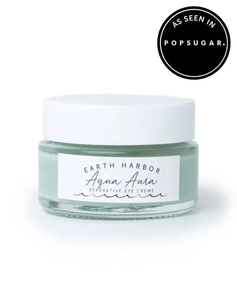 Earth Harbor Aqua Aura Awakening Eye Cream in a sleek jar, designed to refresh and hydrate the delicate skin around the eyes.