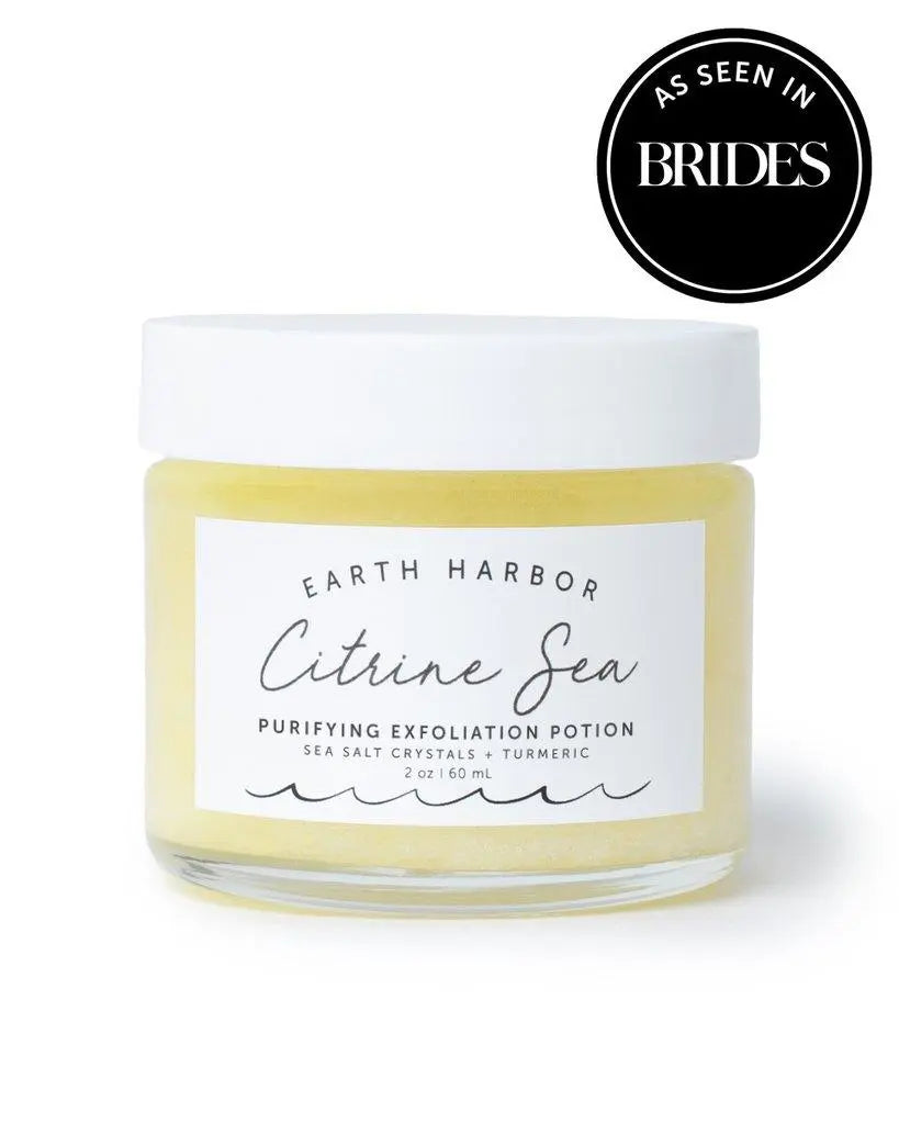 Earth Harbor Citrine Sea Purifying Exfoliation Polish in a jar, featuring natural skincare with exfoliating ingredients and a bright yellow color.