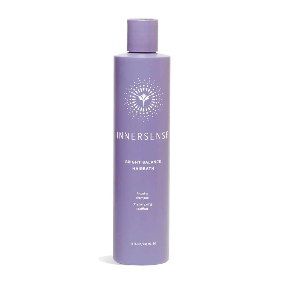 Innersense Organic Beauty Bright Balance Hairbath bottle with white label and pump, set against a neutral background.
