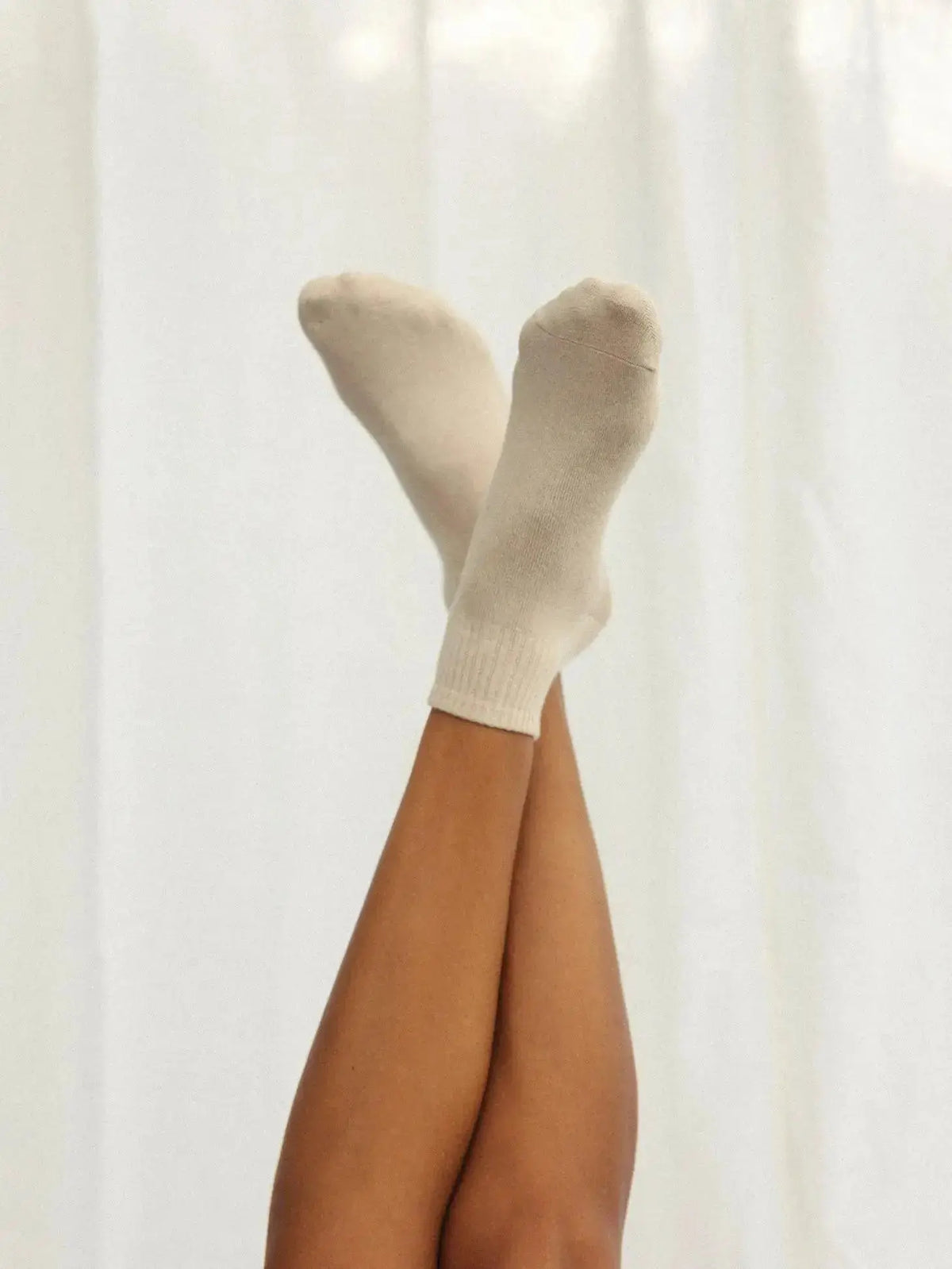 Nat + Noor ankle socks in bone color, featuring a soft fabric blend and subtle branding, perfect for casual wear.
