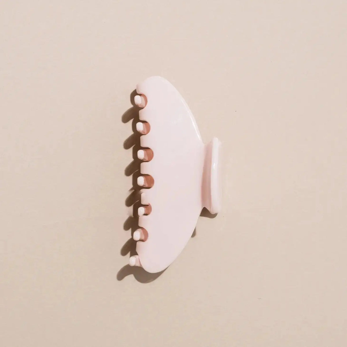 Nat + Noor Jaycee Hair Claw in blush, a stylish hair accessory with a sleek claw design for securing hair effortlessly.