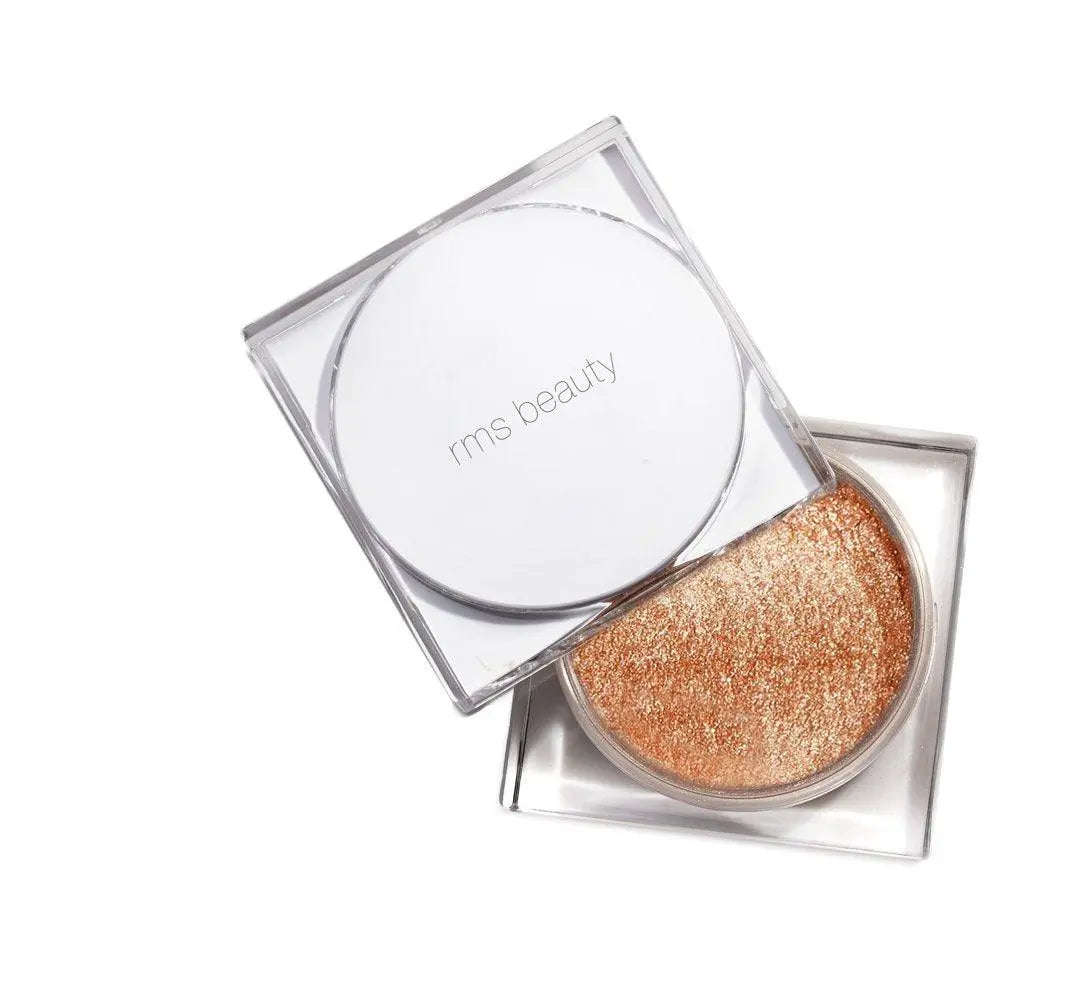 RMS Beauty Living Glow face and body powder in a compact, highlighting a luminous, natural makeup look.