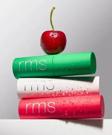 RMS Beauty Mini Lip Oil Trio featuring four mini lip oils in clear, glossy bottles with white caps, displayed on a neutral background.