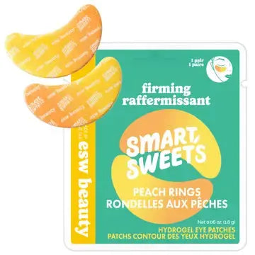 ESW Beauty x SmartSweets eye patches applied under eyes, featuring a clear gel formula for revitalizing skincare.
