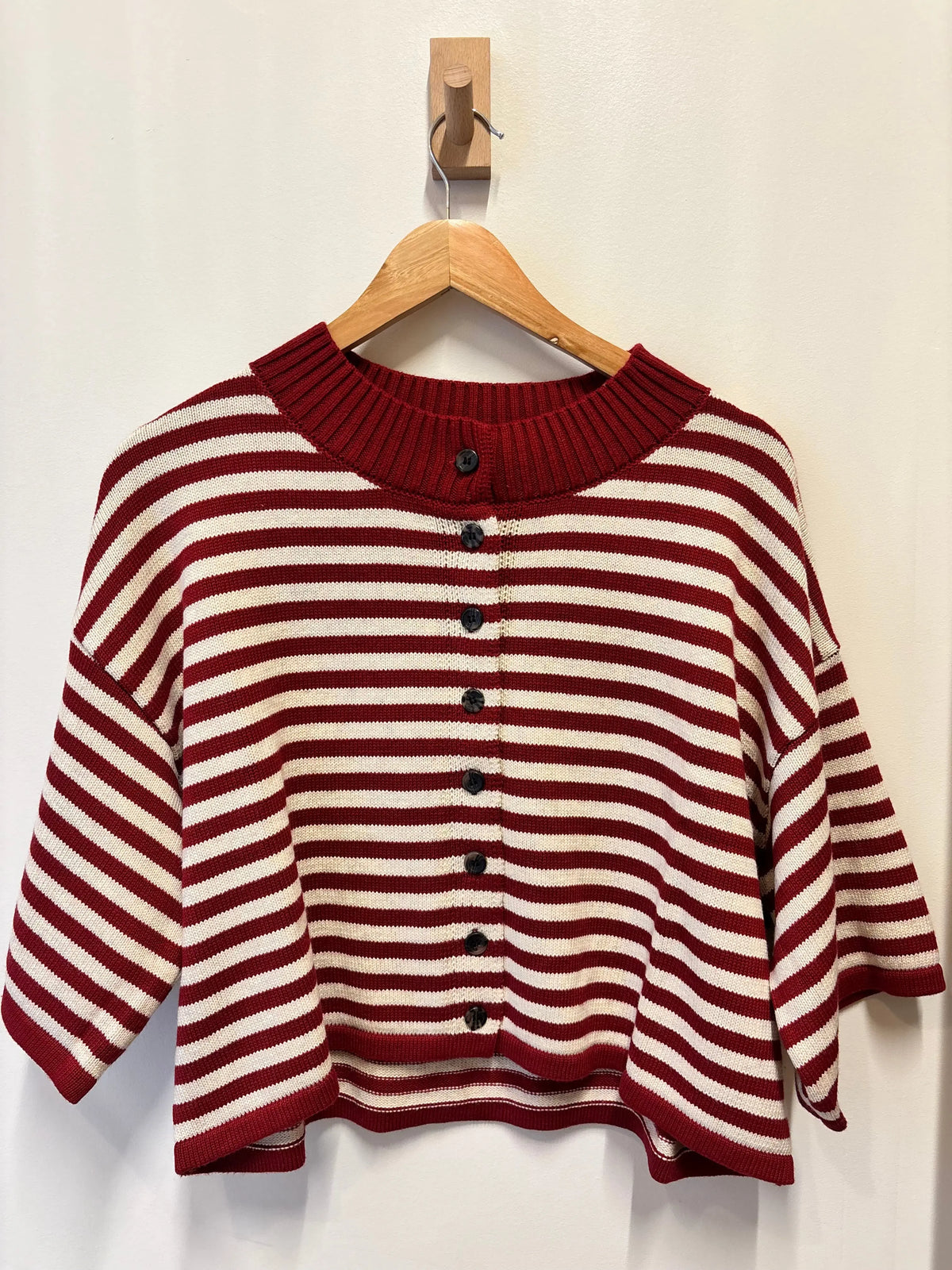 Olivaceous Briar striped cardigan in soft knit fabric, featuring a button-up front and ribbed cuffs and hem.