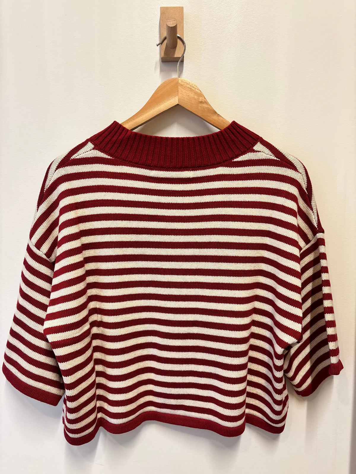 Olivaceous Briar striped cardigan featuring a cozy knit fabric and button closure, styled with a relaxed fit in earthy tones.