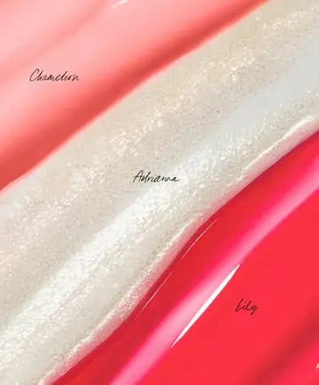 Three RMS Beauty Mini Lip Oils in a variety of shades, displayed in a sleek, compact set with glossy packaging.