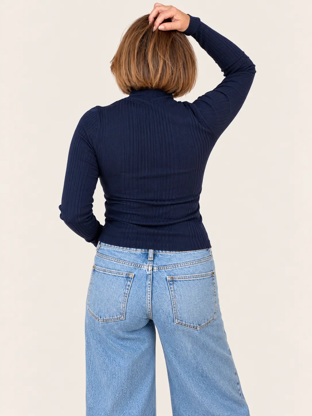 Gray Ellis ribbed mock neck sweater by Stateside, featuring a close-up of the textured fabric and high neckline.