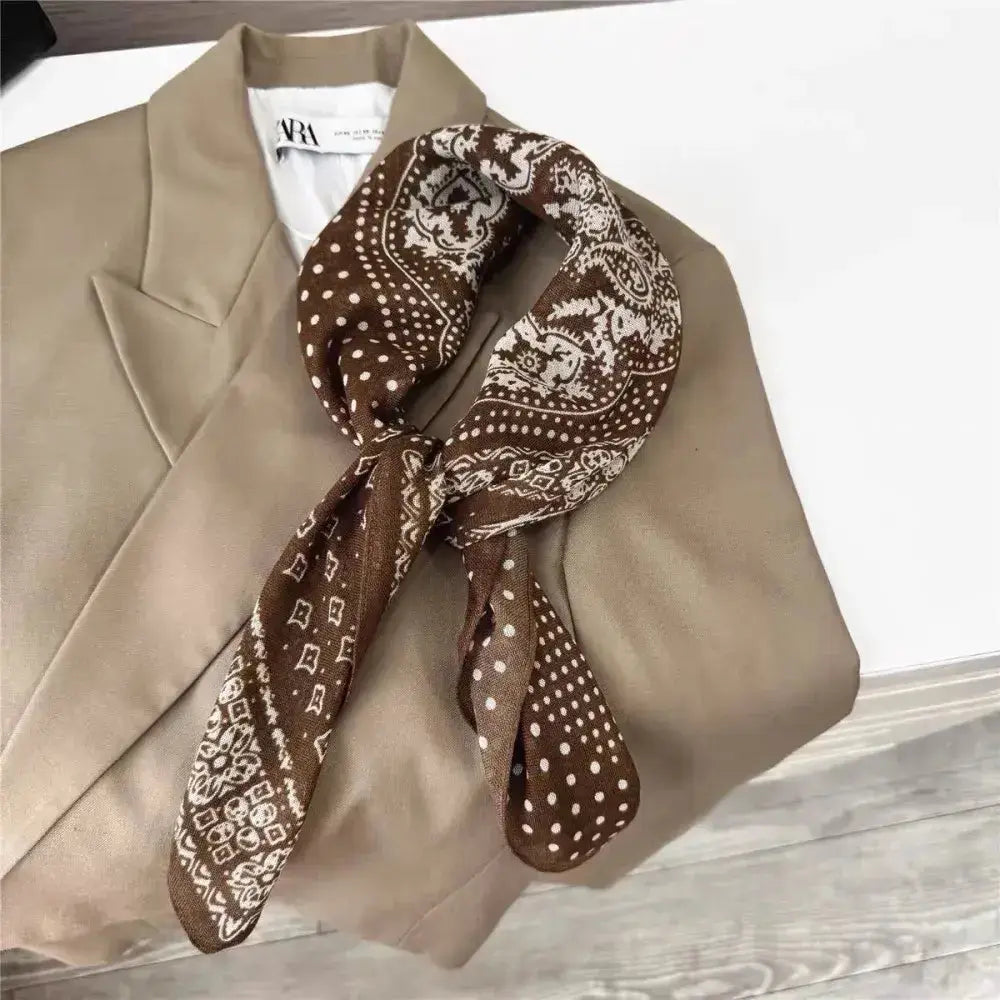 Lineta mocha bandana scarf displayed flat, showcasing its warm brown color and classic triangular shape