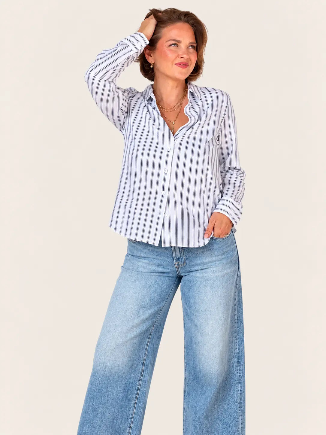 Stateside Parker striped button-down shirt, casual men's apparel with blue and white vertical stripes, laid flat on a white background.